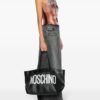 22303328_52173756_1000.jpg Moschino logo-print interwoven leather tote bag