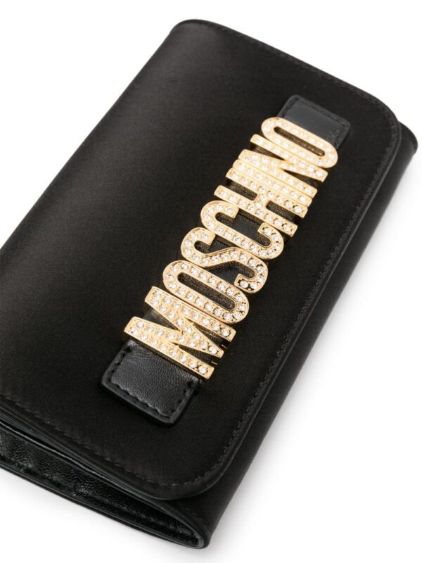 22348143_52279209_1000.jpg Moschino rhinestone-embellishment logo-lettering bag