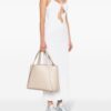 22537325_52534752_1000.jpg Stella McCartney logo-studded faux-leather tote bag