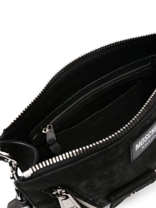 22538711_52526475_1000.jpg Moschino logo-patch nubuck clutch bag
