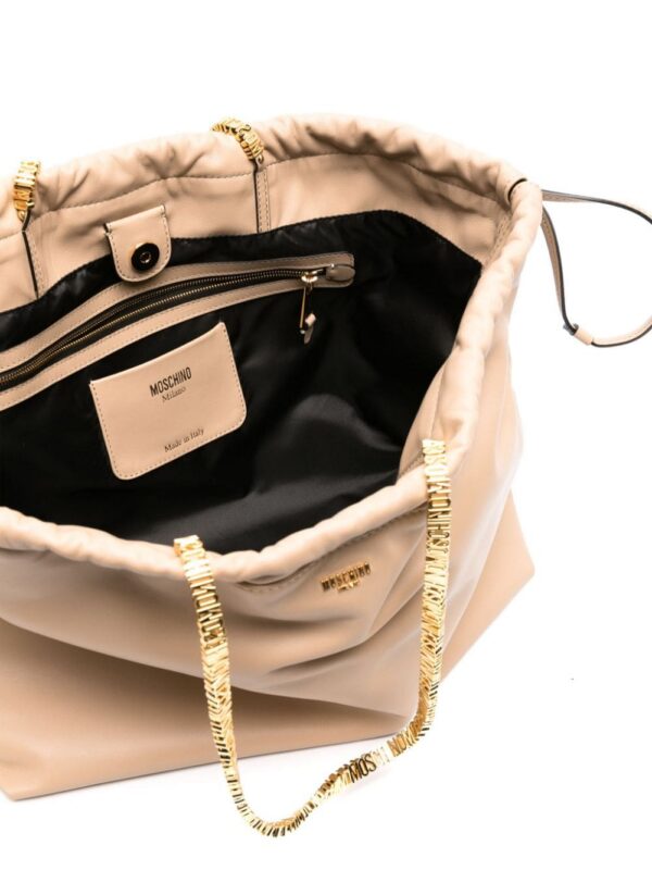 22697697_52857970_1000.jpg Moschino logo-lettering leather tote bag