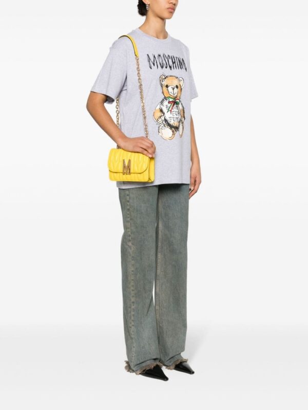22718063_52935080_1000.jpg Moschino small logo-quilted crossbody bag