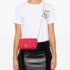 22718251_52935693_1000.jpg Moschino logo-quilted crossbody bag
