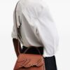 22999640_53447943_1000.jpg Karl Lagerfeld x Amber Valletta Mirum top-handle bag