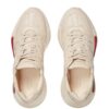 12562683_22090061_1000.jpg Gucci Rhyton-logo leather sneakers