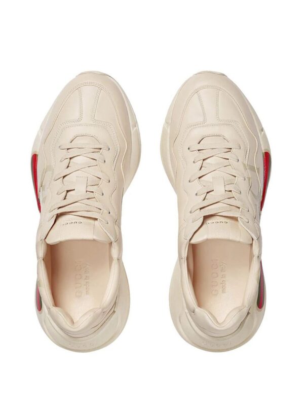 12562683_22090061_1000.jpg Gucci Rhyton-logo leather sneakers