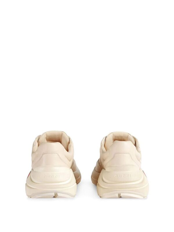 12562683_22090062_1000.jpg Gucci Rhyton-logo leather sneakers
