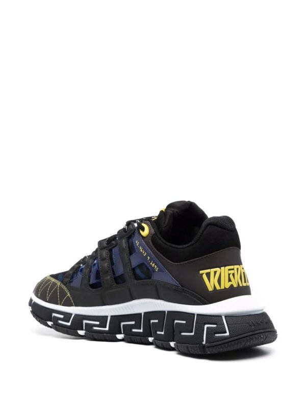 16818272_34842653_1000.jpg Versace Trigreca panelled cut-out sneakers