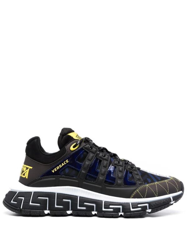 16818272_34844173_1000.jpg Versace Trigreca panelled cut-out sneakers