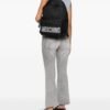 23712680_54059176_1000.jpg Moschino logo lettering quilted backpack