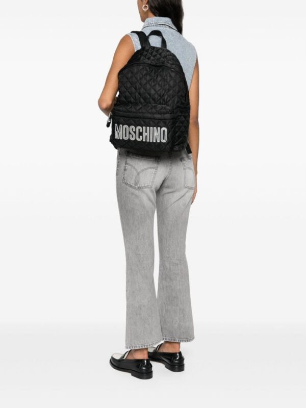 23712680_54059176_1000.jpg Moschino logo lettering quilted backpack