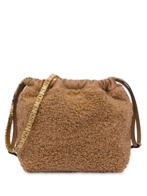 23720453_53593521_1000.jpg Moschino logo-lettering faux-shearling shoulder bag