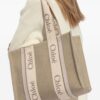 23844258_53812864_1000.jpg Chloé medium Woody logo-strap linen tote bag