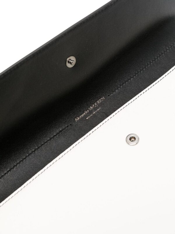 23894909_54000004_1000.jpg Alexander McQueen skull-stud leather clutch