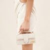 23E213BA006-3071-140_10-scaled-1.jpg Jacquemus Le Bambino Mini flap bag.