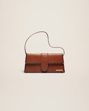 23E231BA049-3000-850_1_main.jpg Jacquemus Le Bambino long lacet Long laced flap bag.