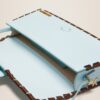 23E231BA049-3108-320_14.jpg Jacquemus Le Bambino long lacet Long laced flap bag.