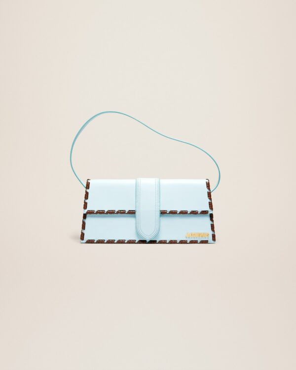 23E231BA049-3108-320_1_main.jpg Jacquemus Le Bambino long lacet Long laced flap bag.