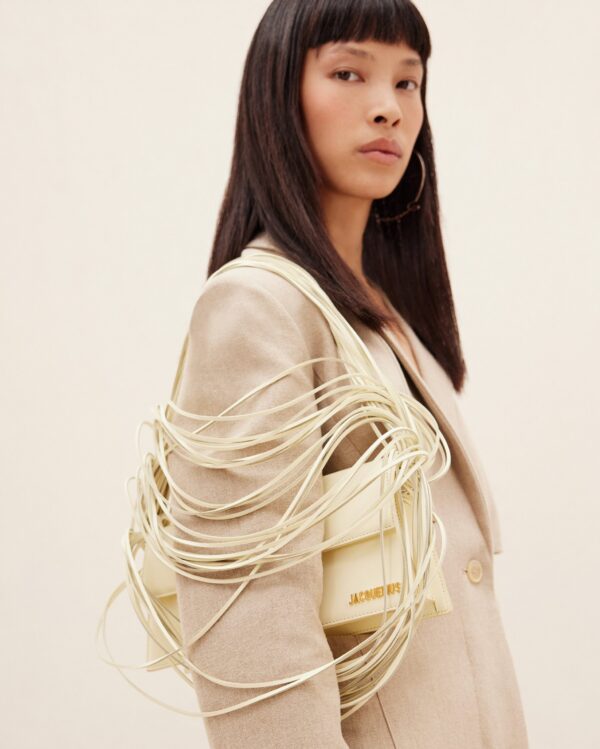 23E231BA051-3108-210_10-scaled-1.jpg Jacquemus Le Bambino long Ficiu Strand strap flap bag.