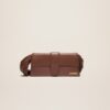 23E231BA051-3108-850_1_main.jpg Jacquemus Le Bambino long Ficiu Strand strap flap bag.