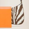 23E231BA062-3066-8AJ_13.jpg Jacquemus Le Bisou imprimé zebre Zebra flapped shoulder bag.