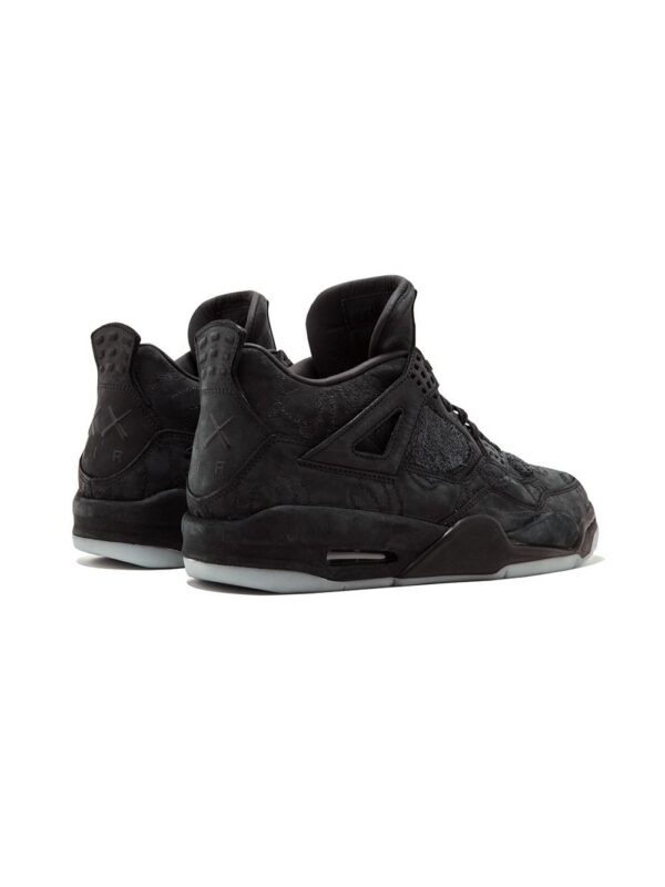 12959907_13486401_1000.jpg Jordan x Kaws Air Jordan 4 Retro "Black" sneakers