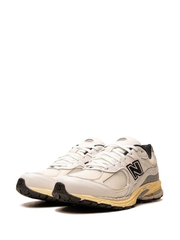 21586650_52310687_1000.jpg New Balance x thisisneverthat 2002R sneakers