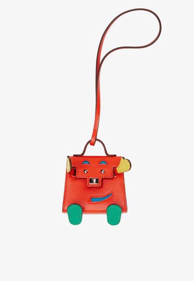 hermescapucinejaunedenaplesvertvertigoandbluezanzibartadelaktandchevrequelleidolekellydollbagcharmpalladiumhardware2021_400x_a4fd2687-be87-49fc-98b0-2add86b5d8b9.jpg Hermès Kelly Quelle Idole Bag Charm in Capucine, Jaune De Naples, Vert Vertigo and Zanzibar Tadelakt and Chèvre Mysore bag